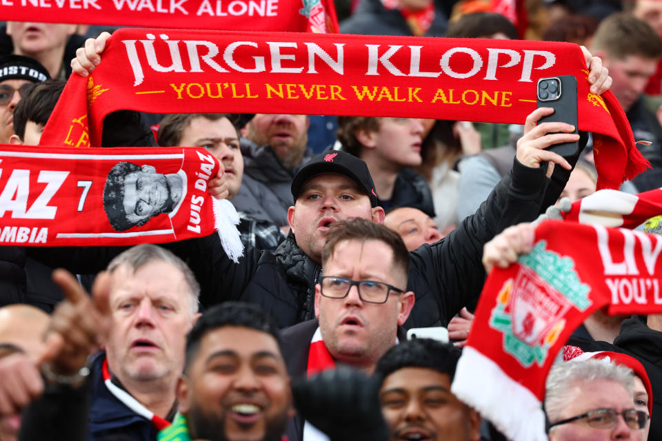 A Liverpool fan displays a Jurgen Klopp scarf during the FA Cup clash against Norwich City at Anfield. 