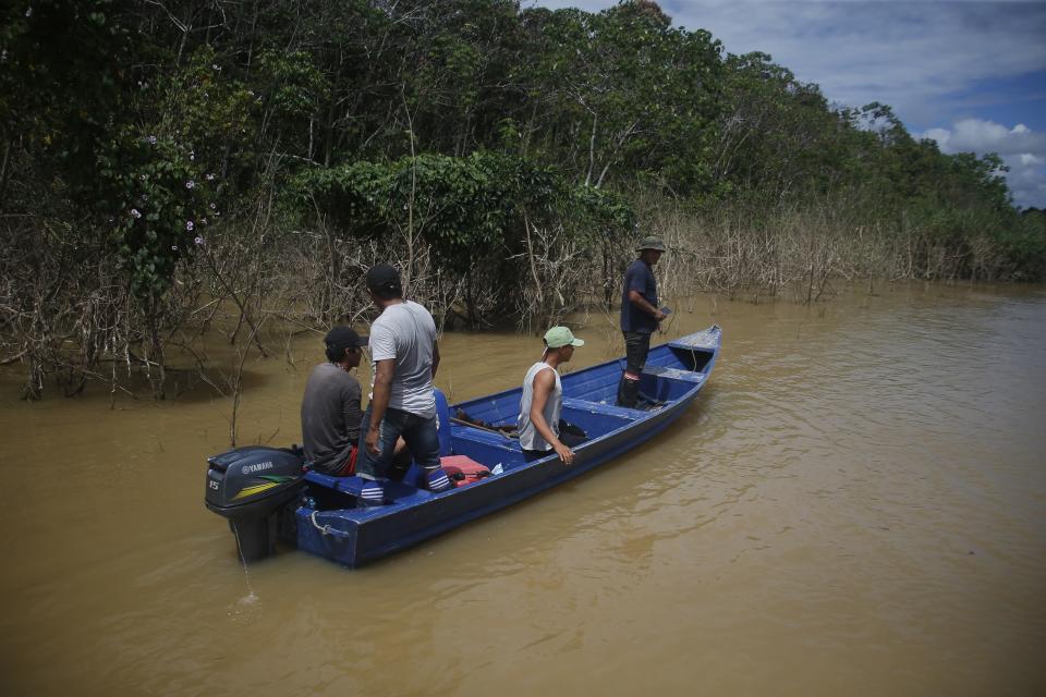 FILE - Indigenous people motor along on the Itaquai river, searching for British journalist Dom Phillips and Indigenous affairs expert Bruno Araujo Pereira in the Javari Valley Indigenous territory, Atalaia do Norte, Amazonas state, Brazil, June 9, 2022. As the one-year anniversary of the murders approached, The Associated Press returned to the Javari Valley to describe the place where the two were killed. (AP Photo/Edmar Barros, File)