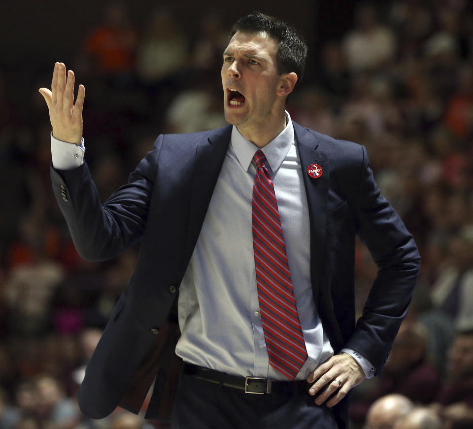 Louisville head coach David Padgett yells to his team during a game against Virginia Tech on Feb. 24. (AP)