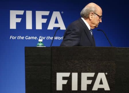 FIFA President Sepp Blatter leaves after his statement during a news conference at the FIFA headquarters in Zurich, Switzerland, June 2, 2015. REUTERS/Ruben Sprich