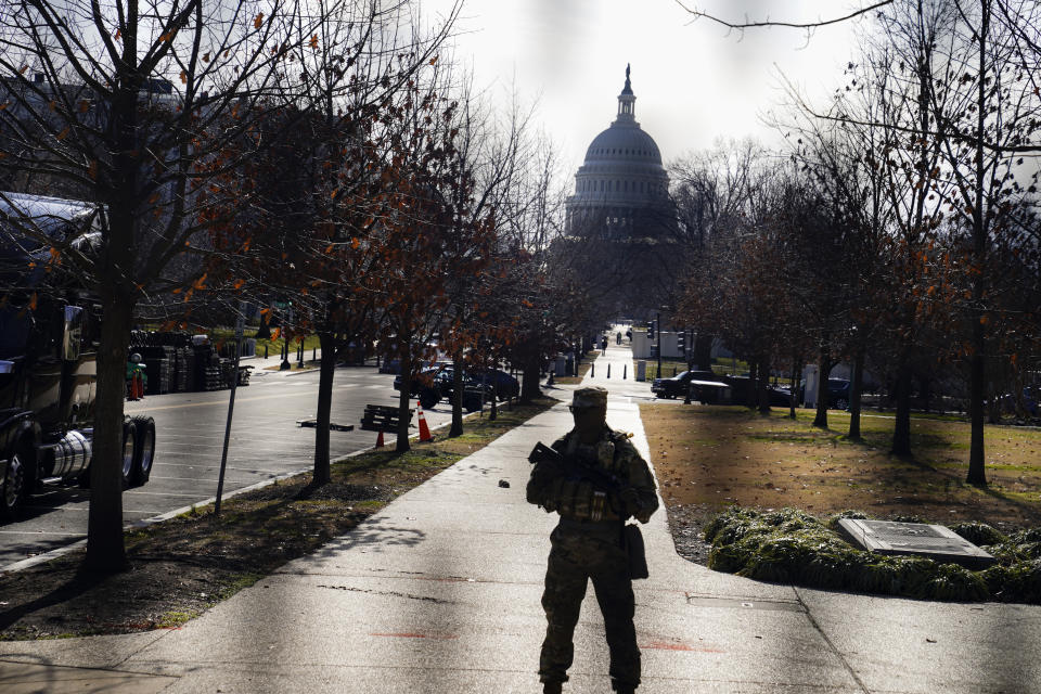 The U.S. Capitol is seen through security fencing on Saturday, Jan. 16, 2021, in Washington as security is increased ahead of the inauguration of President-elect Joe Biden and Vice President-elect Kamala Harris. (AP Photo/John Minchillo)