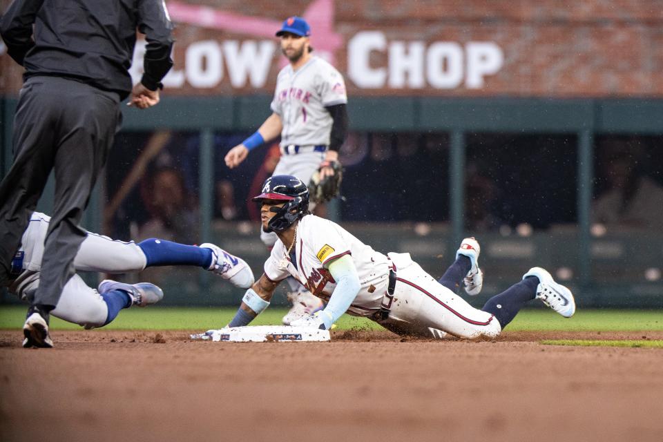 Atlanta Braves outfielder Ronald Acuna Jr. (13) steals second base during the first inning pn April 9, 2024, at Truist Park.