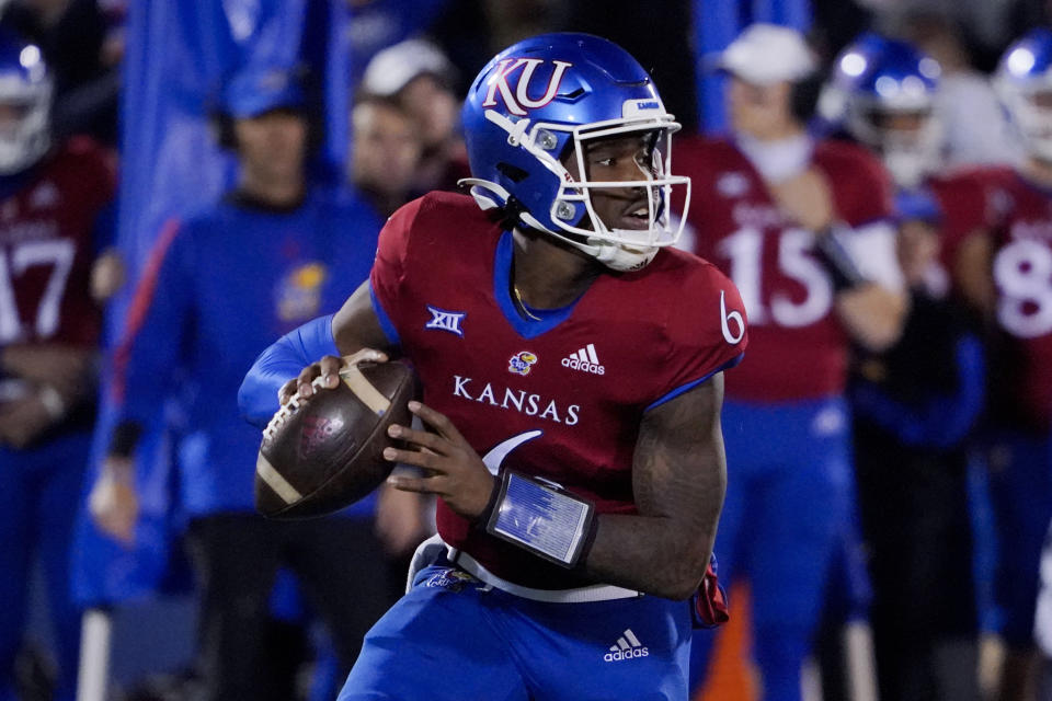 FILE - Kansas quarterback Jalon Daniels looks to pass the ball during an NCAA college football game against West Virginia Saturday, Nov. 27, 2021, in Lawrence, Kan. Kansas is set to kick off its season on Sept. 2, 2022, against Tennessee Tech. (AP Photo/Ed Zurga, File)