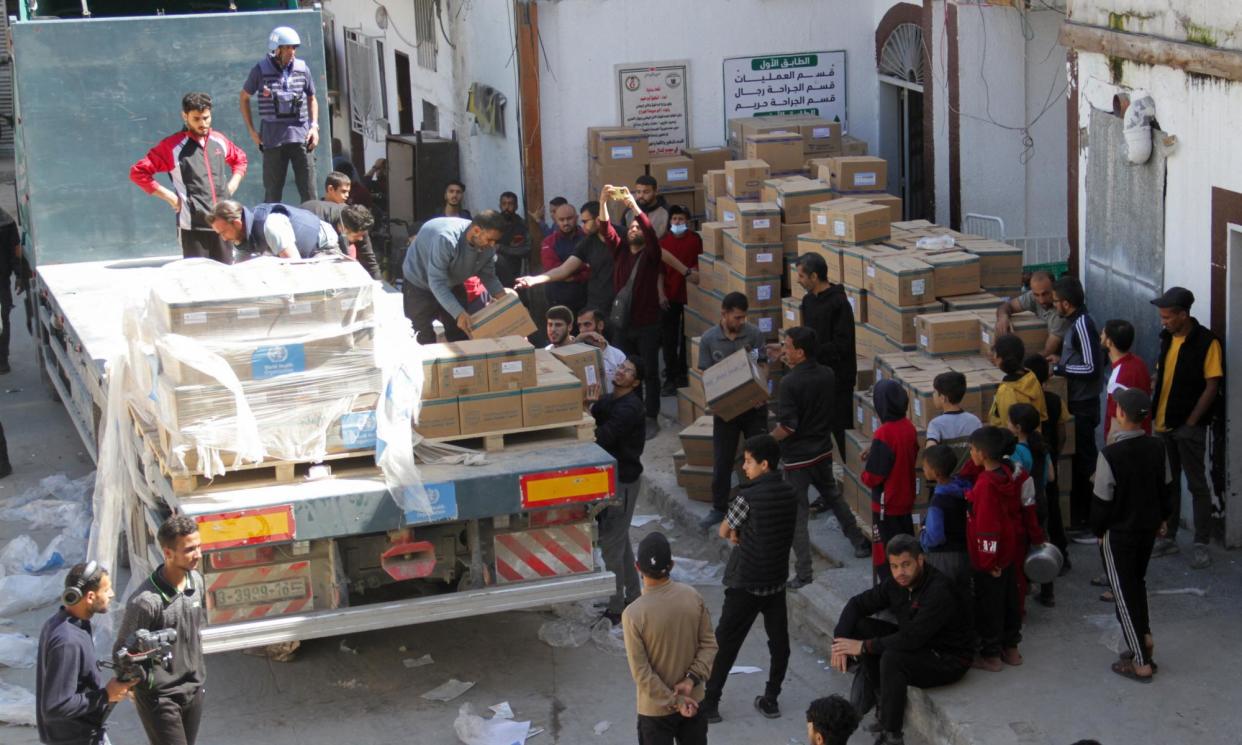 <span>Medical aid is unloaded from a lorry in the northern Gaza Strip last week.</span><span>Photograph: Mahmoud Issa/Reuters</span>