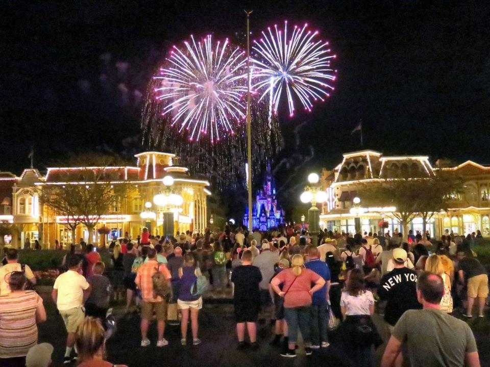 Guests watching fireworks at Walt Disney World Orlando before the park closed on March 15.