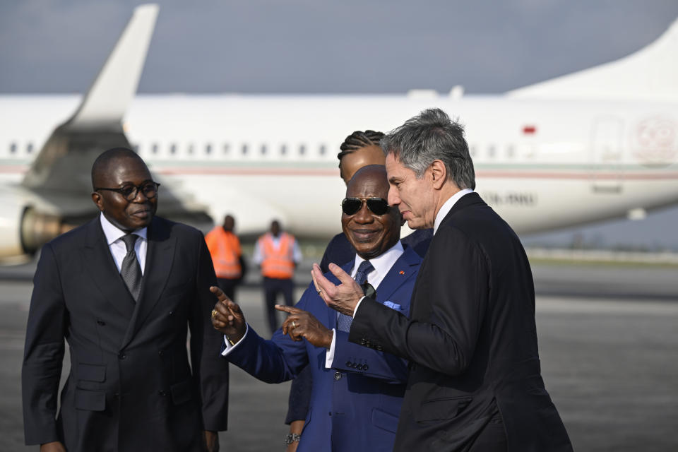 Ivory Coast's Minister of Foreign Affairs Kacou Houadja Leon Adom, second from right, welcomes US Secretary of State Antony Blinken, right, at the Felix Houphouet-Boigny International Airport in Abidjan, Ivory Coast, Monday, Jan. 22, 2024. (Andrew Caballero-Reynolds/Pool Photo via AP)