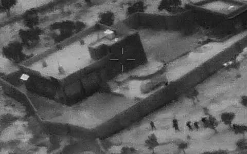 US Special Forces, figures at lower right, moving toward compound of Islamic State leader Abu Bakr al-Baghdadi  - Credit: Department of Defense&nbsp;