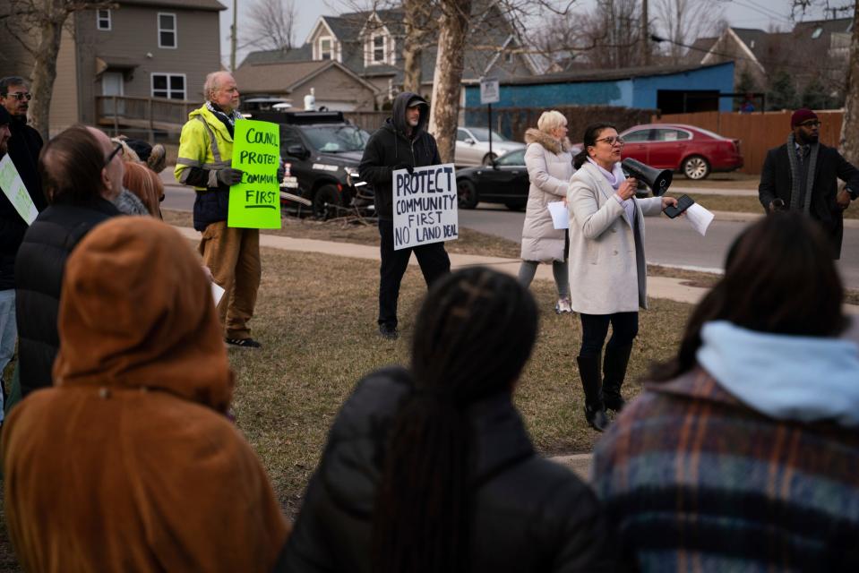 Community members gather as Democratic U.S. Rep. Rashida Tlaib speaks during a rally urging Detroit City Council members to vote against a land deal with Detroit International Bridge Company and require community protections in southwest Detroit on Monday, Feb. 20, 2023.