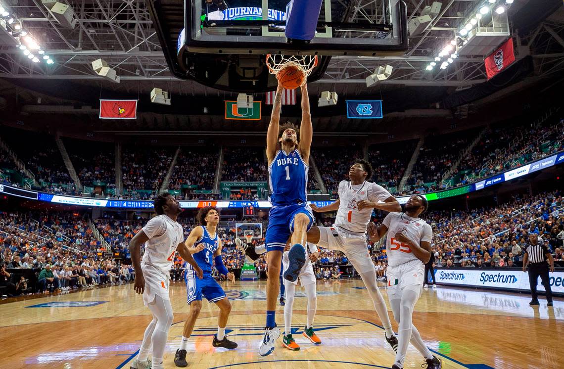 Duke’s Dereck Lively II (1) gets a dunk against Miami’s Anthony Walker (1) during the first half during in the semi-finals of the ACC Tournament on Friday, March 10, 2023 at the Greensboro Coliseum in Greensboro, N.C.