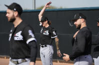 Chicago White Sox pitcher Mike Clevinger stretches back during an MLB spring training baseball practice, Saturday, Feb. 18, 2023, in Phoenix. (AP Photo/Matt York)