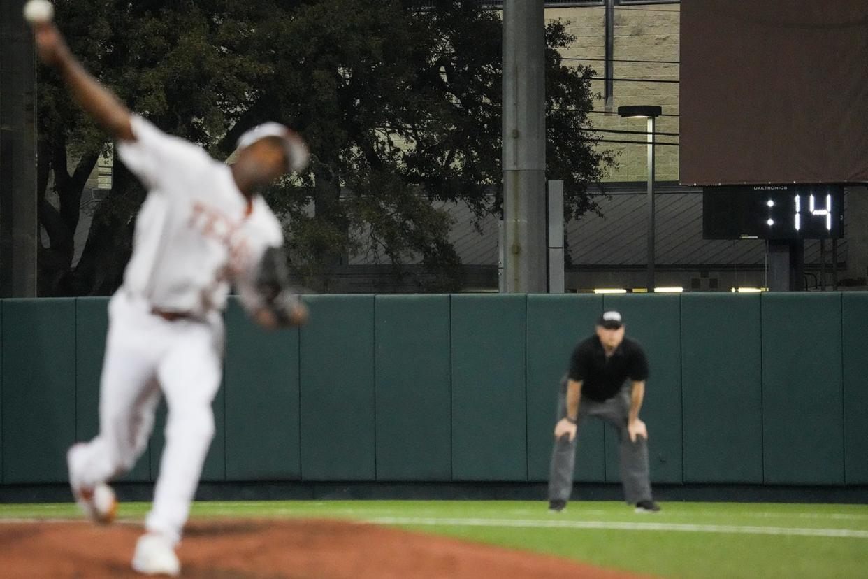 The new 20-second action clock shows Texas' Lebarron Johnson Jr. throwing his pitch with plenty of time to spare — a whole 14 seconds — during Wednesday night's 3-0 loss to LSU. Johnson, just like other pitchers and teams, is finding out the hard way that the NCAA means business with its new rule.