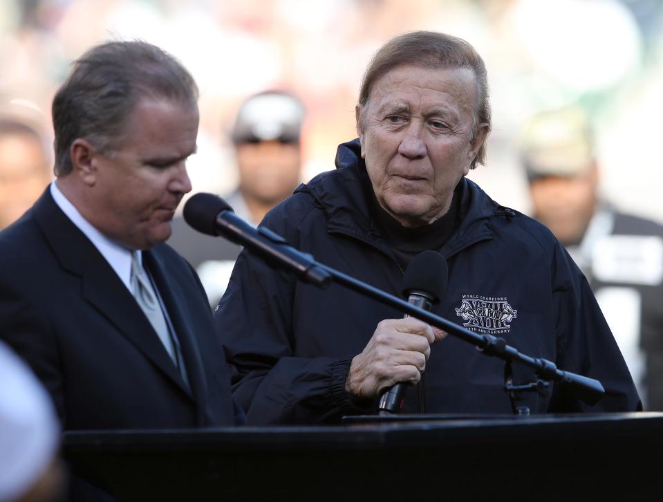 Tom Flores, right, coach of the Los Angeles Raiders 1983 Super Bowl XLVIII winning team, speaks at halftime during the Raiders game against the Denver Broncos at O.com Coliseum in Oakland, Calif., on Sunday, Dec. 29, 2013. The Raiders honored the 30th anniversary of the 1983 championship team at halftime.  (Jane Tyska/Bay Area News Group)(Digital First Media Group/Bay Area News via Getty Images)