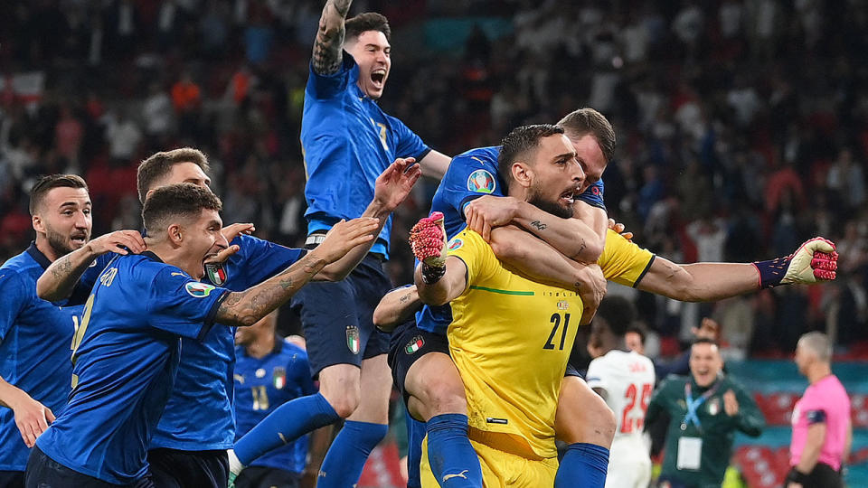 Pictured here, Italy celebrate after their penalty shootout victory against England.