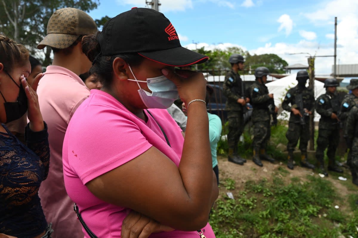 Relatives of inmates of the Women's Center for Social Adaptation (CEFAS) prison crie outside the detention center after a fire following a brawl between inmates in Tamara, some 25 kilometers from Tegucigalpa, Honduras, on June 20, 2023. Clashes between rival gangs at a woman's prison in Honduras left at least 41 people dead Tuesday, police told AFP. The violence took place at a prison some 25 kilometers (about 15 miles) north of the capital Tegucigalpa, according to police spokesman Edgardo Barahona, who put the 