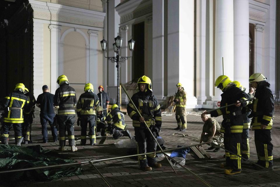 Firefighters set up a tent outside the Odesa Transfiguration Cathedral after the church was heavily damaged in Russian missile attacks in Odesa, Ukraine, Sunday, July 23, 2023. (AP Photo/Jae C. Hong)