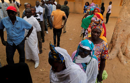 People wait to cast their vote during presidential election, at a polling station in Fatick, Senegal February 24, 2019. REUTERS/Zohra Bensemra