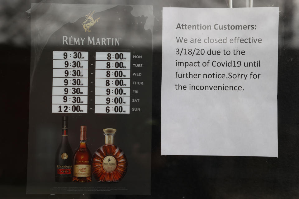 MERRICK, NEW YORK - MARCH 31:  A sign at Frank's Liquor store  states that the store is closed due to the coronavirus pandemic on March 31, 2020 in Merrick, New York. The World Health Organization declared coronavirus (COVID-19) a global pandemic on March 11.   (Photo by Al Bello/Getty Images)