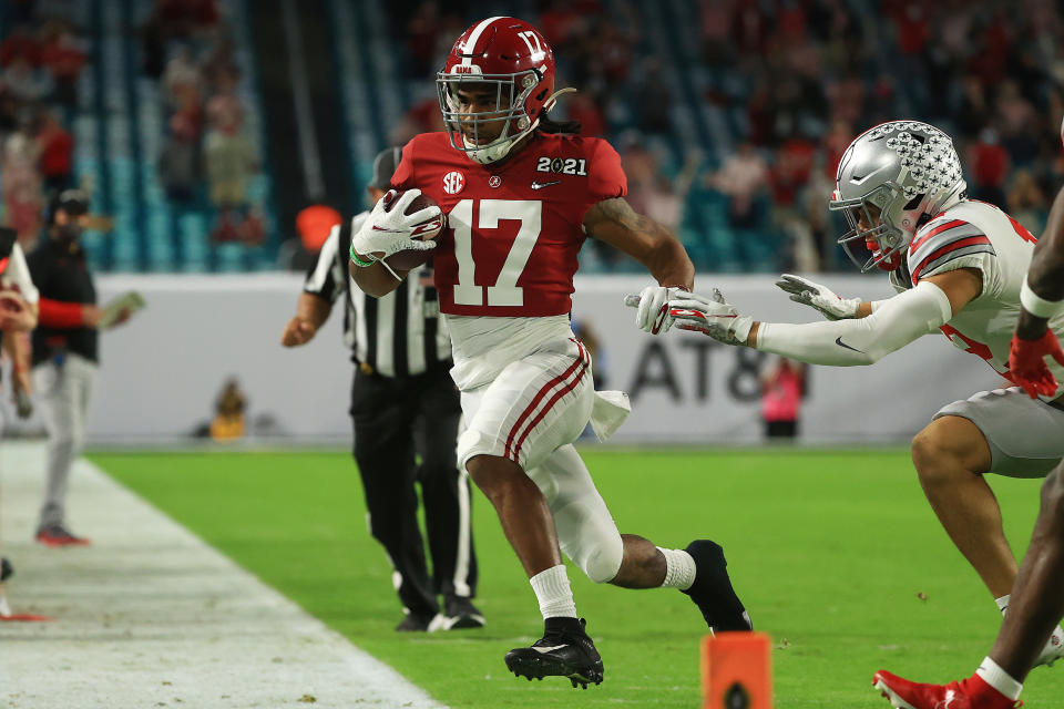 Alabama WR Jaylen Waddle hobbled out of bounds against the Ohio State Buckeyes in his first game back from injury on Monday. (Photo by Mike Ehrmann/Getty Images)