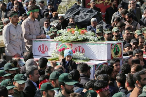 Members of Iran's Revolutionary Guards attend the funeral of fellow guards who were killed in Wednesday's suicide attack