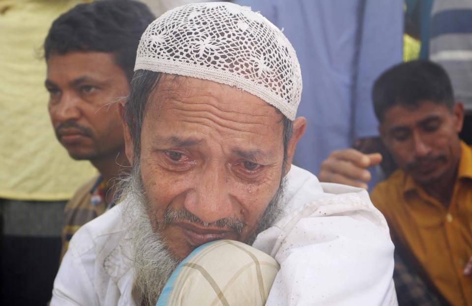 A Rohingya refugee cries during a gathering to mark the fifth anniversary of their exodus from Myanmar to Bangladesh, at a Kutupalong Rohingya refugee camp at Ukhiya in Cox's Bazar district, Bangladesh, Thursday, Aug. 25, 2022. Hundreds of thousands of Rohingya refugees on Thursday marked the fifth anniversary of their exodus from Myanmar to Bangladesh, while the United States, European Union and other Western nations pledged to continue supporting the refugees' pursuit of justice in international courts.(AP Photo/ Shafiqur Rahman)