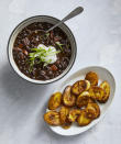 <p>The stellar combo of black beans, fire-roasted tomatoes, onion, bell peppers, and spices cook in the slow cooker while you whip up the part that makes this vegan meal a real win: the fried plantains. Black beans and plantains are the best flavor friends, as you’re soon to find out, and even people who aren't vegans will enjoy this meat-less rendition.</p> <p><strong>Get the Recipe:</strong> <a rel="nofollow noopener" href="https://www.realsimple.com/food-recipes/browse-all-recipes/cuban-black-bean-chili" target="_blank" data-ylk="slk:Slow-Cooker Cuban Black Bean Vegan Chili;elm:context_link;itc:0;sec:content-canvas" class="link ">Slow-Cooker Cuban Black Bean Vegan Chili</a></p>