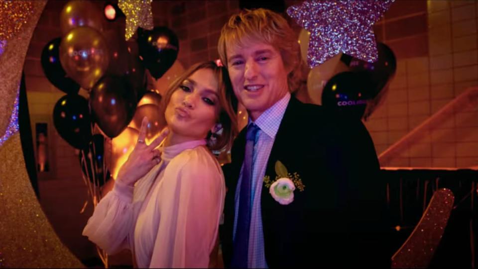 Marry Me Movie, one of the upcoming Valentine's Day movies, starring JLo and Owen Wilson, an image of them at the school dance