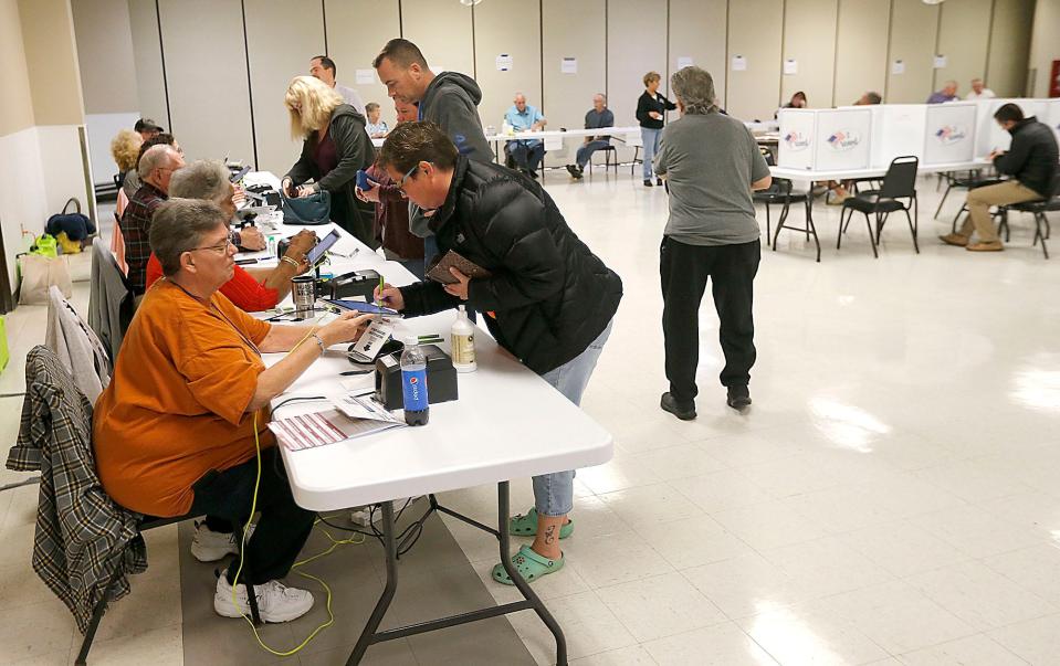 Voters check in with the poll workers at the Ashland Fraternal Order of Eagles #2178 polling place on Eastlake Drive on Tuesday morning, Nov. 8, 2022. TOM E. PUSKAR/ASHLAND TIMES-GAZETTE
