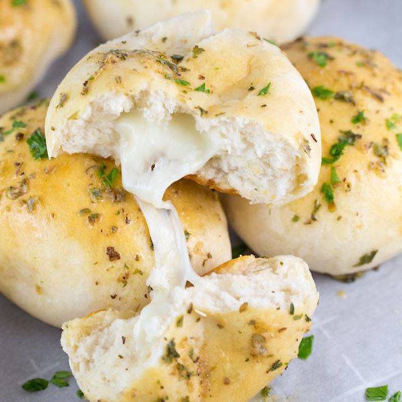 <p>Center Cut Cook</p><p>Cheesy Garlic Bread Bombs are delicious little garlic bread bites oozing with mozzarella and slathered with lots of garlic-buttery goodness. </p><p><strong>Get the recipe: </strong><a href="https://www.centercutcook.com/cheesy-italian-bread-bombs/" rel="nofollow noopener" target="_blank" data-ylk="slk:Cheesy Garlic Bread Bombs;elm:context_link;itc:0;sec:content-canvas" class="link "><strong>Cheesy Garlic Bread Bombs</strong></a></p>