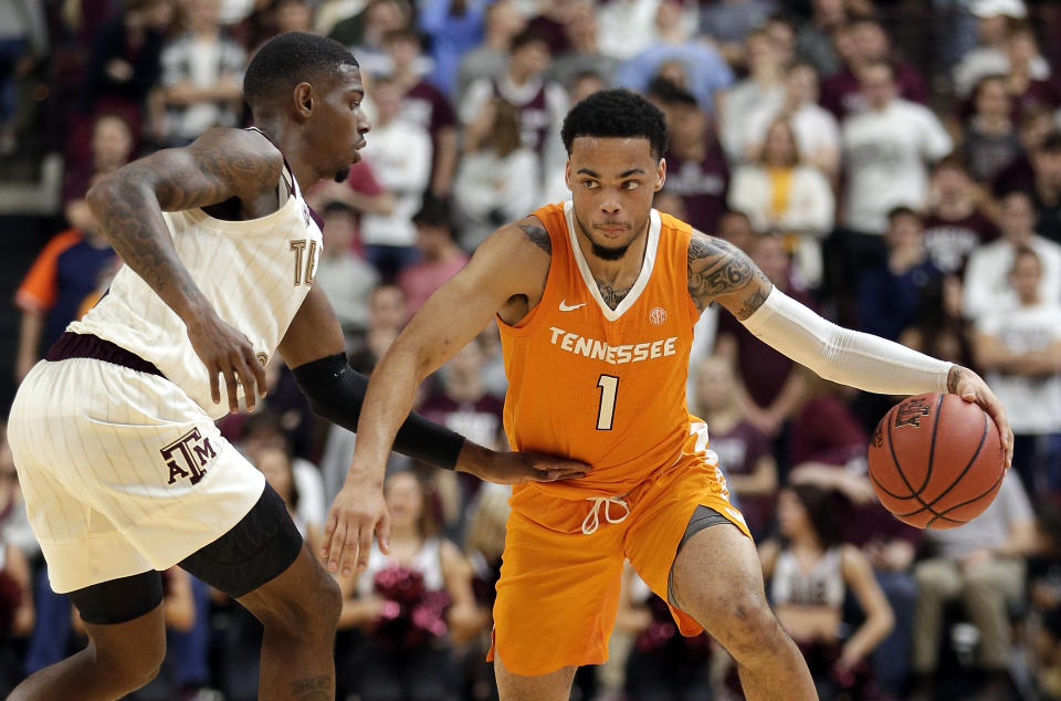 Tennessee guard Lamonte Turner (1) drives around Texas A&M guard Jay Jay Chandler, left, during the second half of an NCAA college basketball game Saturday, Feb. 2, 2019, in College Station, Texas. (AP Photo/Michael Wyke)