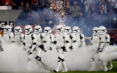 Stormtroopers march down the field during the halftime of an NFL football game between the Chicago Bears and the Minnesota Vikings - Credit: AP