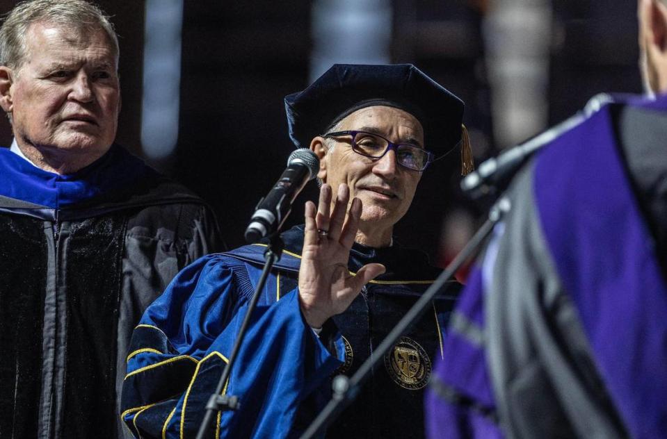 Florida International University Board Chair Dean Colson, left, joins Kenneth Jessell as he takes the oath during his investiture at FIU’s International University Modesto A. Maidique campus in Miami, Thursday May 18 , 2023. Jessell was sworn in as the sixth president of FIU.