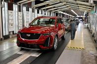 FILE PHOTO: Final inspection is performed as the vehicles are ready to leave the assembly line at the General Motors (GM) manufacturing plant in Spring Hill