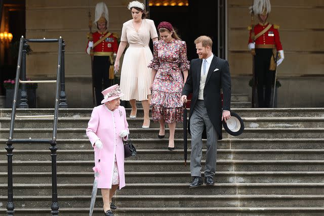 <p>Yui Mok - WPA Pool/Getty </p> Queen Elizabeth with Princess Eugenie, Princess Beatrice and Prince Harry in 2019