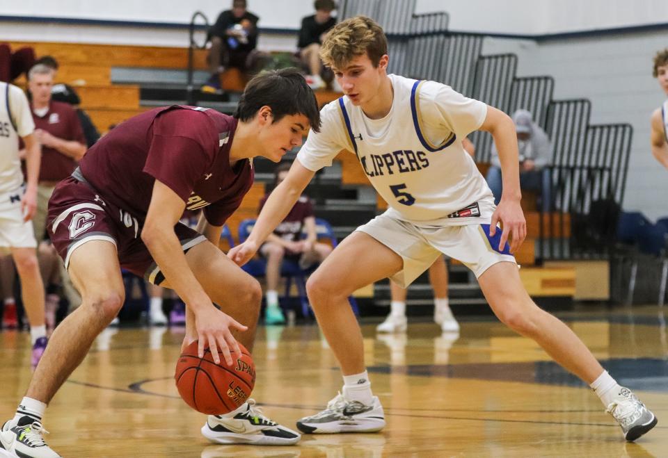 Carver's Robbie Peterson dribbles in front of Norwell's Nick Adams during a game at Norwell High School on Tuesday, Jan. 16, 2024.