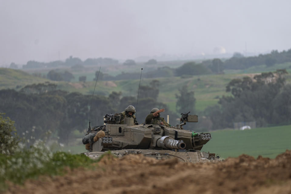 Israeli army tank moves near the Israeli-Gaza border, in southern Israel, Wednesday, Jan. 17, 2024.(AP Photo/Ohad Zwigenberg)