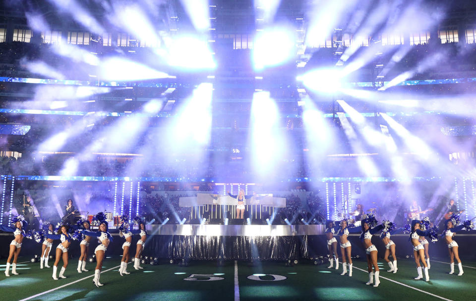 Dolly Parton performs during halftime in the game  (Richard Rodriguez / Getty Images)