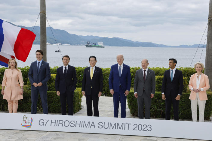 From left, Italy's Prime Minister Giorgia Meloni, Canada's Prime Minister Justin Trudeau, France's President Emmanuel Macron, Japan's Prime Minister Fumio Kishida, U.S. President Joe Biden, Germany's Chancellor Olaf Scholz, Britain's Prime Minister Rishi Sunak and European Commission President Ursula von der Leyen participate in a family photo with G7 leaders before their working lunch meeting on economic security during the G7 summit, at the Grand Prince Hotel in Hiroshima, western Japan Saturday, May 20, 2023. (Jonathan Ernst/Pool Photo via AP)