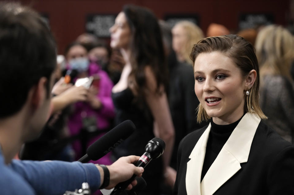 Thomasin McKenzie, right, a cast member in "Eileen," is interviewed at the premiere of the film at the 2023 Sundance Film Festival, Saturday, Jan. 21, 2023, in Park City, Utah. (AP Photo/Chris Pizzello)