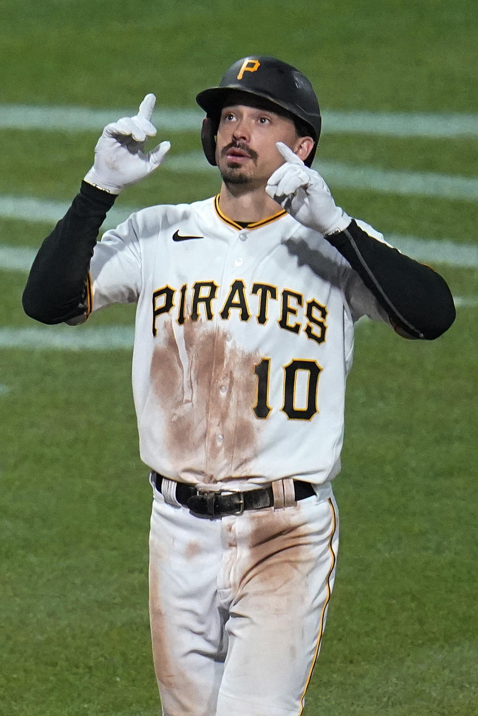 Pittsburgh Pirates' Bryan Reynolds crosses home plate after hitting a solo home run off Chicago Cubs relief pitcher Manuel Rodriguez during the seventh inning of a baseball game in Pittsburgh, Friday, Sept. 23, 2022. (AP Photo/Gene J. Puskar)