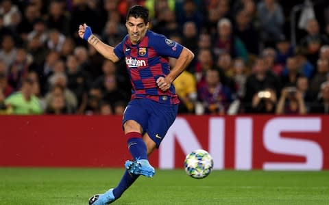 Barcelona's Uruguayan forward Luis Suarez kicks the ball during the UEFA Champions League Group F football match between FC Barcelona and Borussia Dortmund - Credit: JOSEP LAGO/AFP via Getty Images