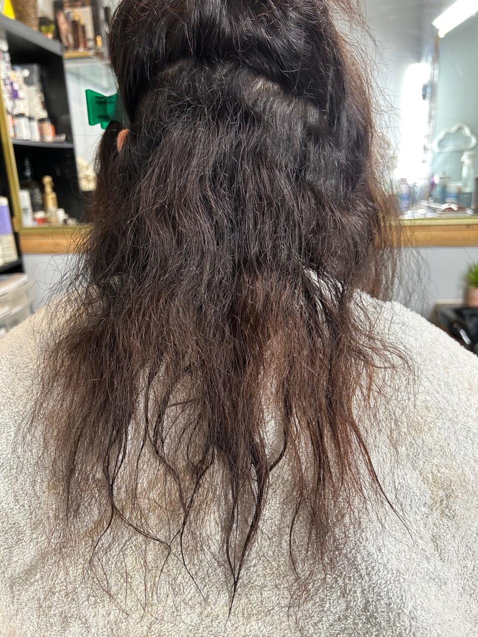 This woman believes her brittle, frizzy hair was caused by using Olaplex. She's among 28 people suing the company, which denies wrongdoing.