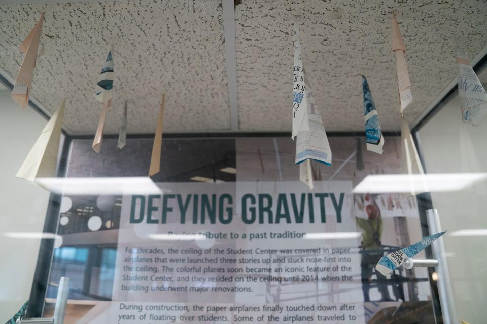 An encased display on the second floor of the Wayne State University Student Center shows paper airplanes stuck to a sampling of drop ceiling. Now this old tradition lives in a mural on the first floor at the Community Financial Credit Union on Monday, Jan. 22, 2024.