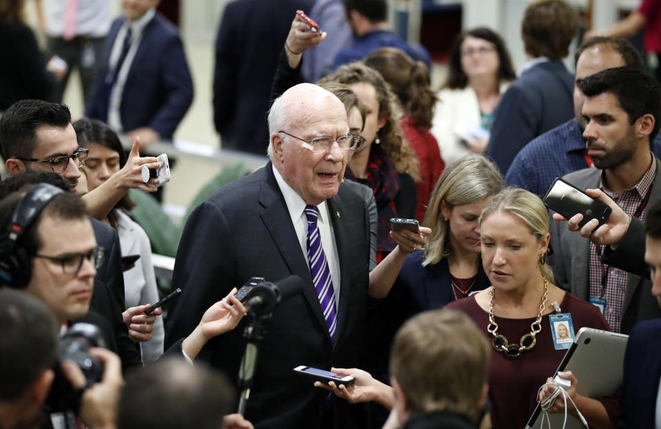 Sen. Patrick Leahy, D-Vt., talks with reporters as he walks, on Capitol Hill, Monday, Sept. 24, 2018 in Washington. (AP Photo/Alex Brandon)