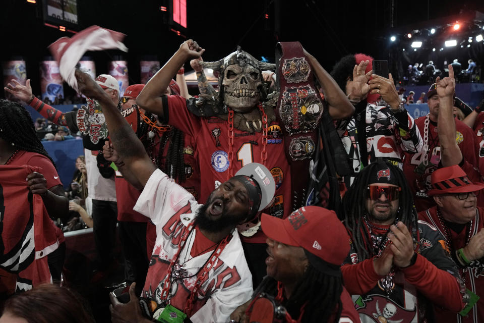 Tampa Bay Buccaneers fans cheer during the first round of the NFL football draft, Thursday, April 27, 2023, in Kansas City, Mo. (AP Photo/Charlie Riedel)