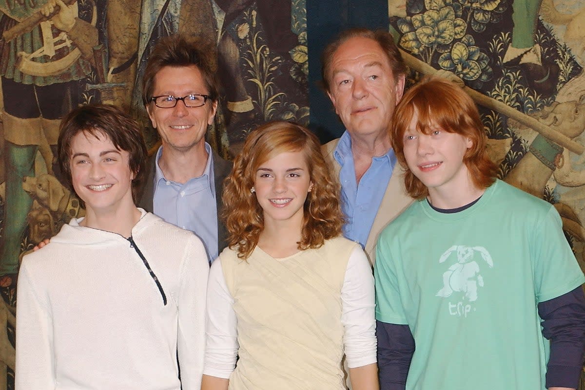 Gary Oldman and Michael Gambon (back right) with the young cast of Harry Potter in 2004 (Getty)