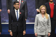 Britain's Prime Minister Rishi Sunak, left and Italy's Prime Minister Giorgia Meloni and leaders pose for a Group photo on the second day of the UK Artificial Intelligence (AI) Safety Summit, at Bletchley Park, in Bletchley, England, Thursday, Nov. 2, 2023. U.S. Vice President Kamala Harris and British Prime Minister Rishi Sunak joined delegates Thursday at a U.K. summit focused on containing risks from rapid advances in cutting edge artificial intelligence. (Leon Neal/Pool Photo via AP)