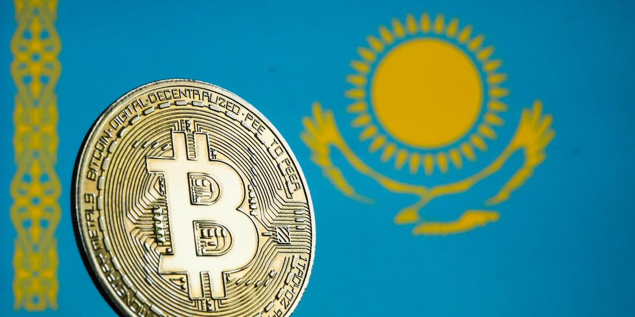 Bitcoin cryptocurrency and flag of Kazakhstan displayed on a screen are seen in this illustration photo taken in Krakow, Poland on January 7, 2022.