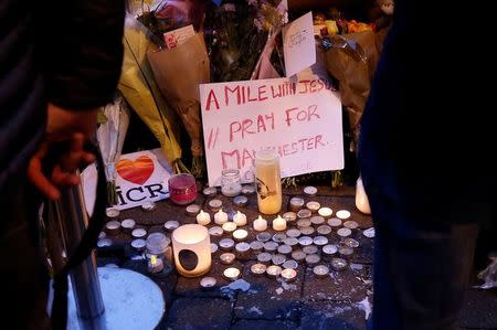 People attend a vigil for the victims of last week's attack at a pop concert at Manchester Arena, in central Manchester, Britain May 29, 2017. REUTERS/Andrew Yates