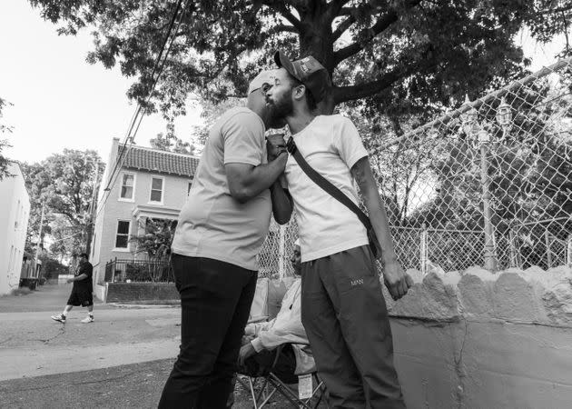 Two men give dap in a Washington neighborhood.