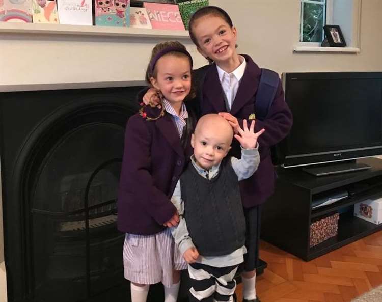 George pictured after with his sisters. (Catherine Baker/SWNS)